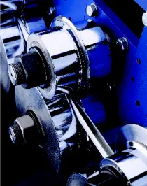 A close up of the gears on an industrial machine