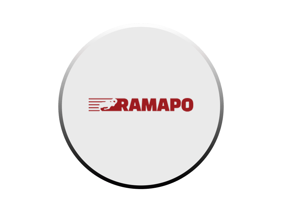 A white button with the word ramapo on it.